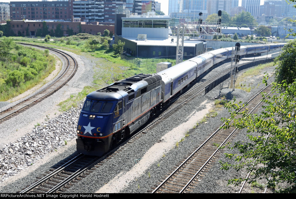 RNCX 1755 leads train P075-02 away from the station